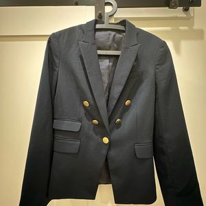 Navy blazer with gold accents